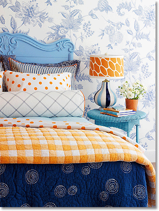bedroom in bright blue, orange and white